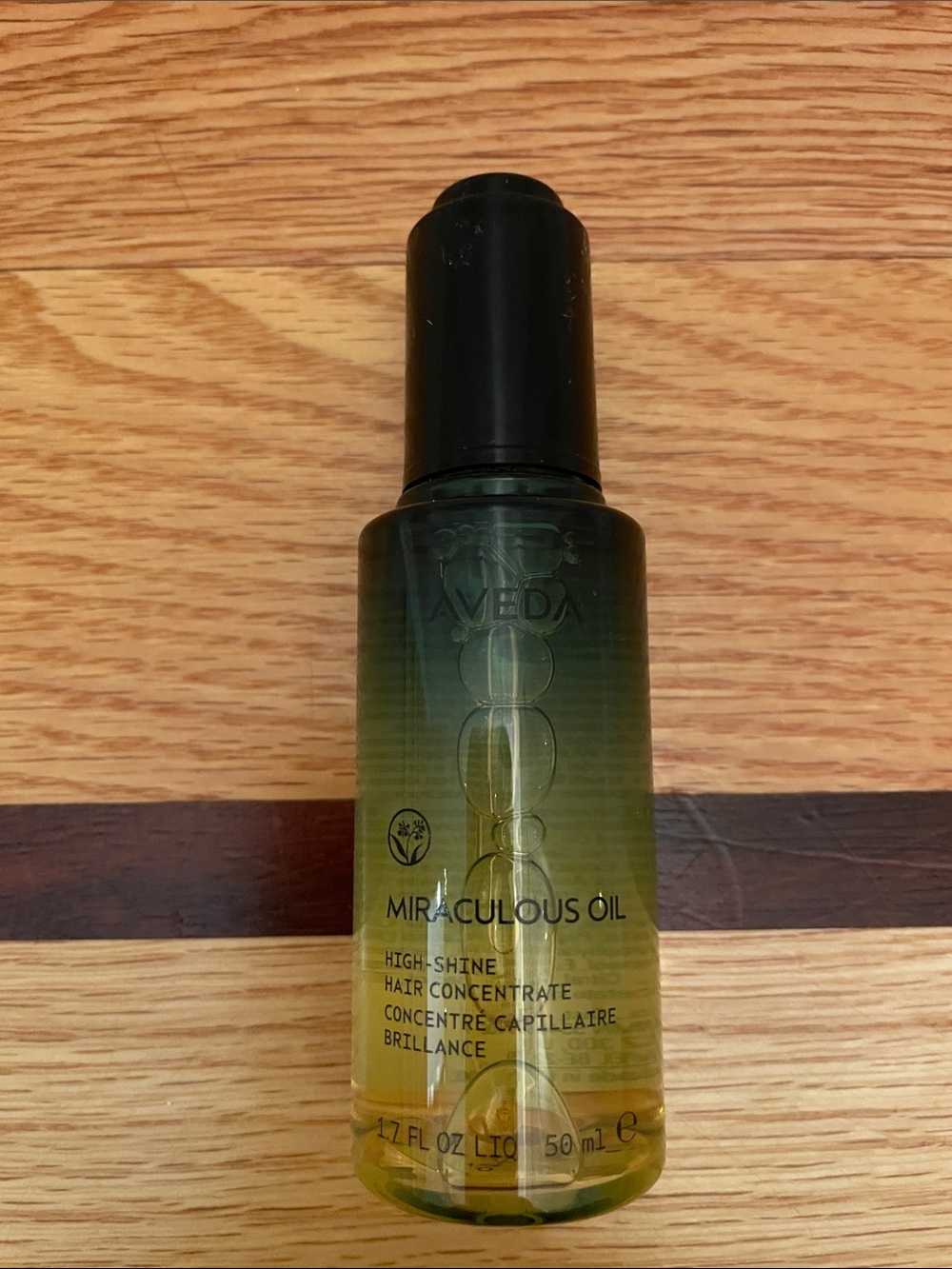 AVEDA Miraculous Oil High-Shine Hair Concentrate - Green and Yellow Bottle